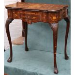A Dutch marquetry inlaid fold-over serpentine front card table, opening to reveal  green baize