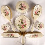 Silver and guilloché enamel dressing table items, pink and white rose decoration, various ages. (8