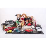 A vintage quantity of dolls and boxed vehicles.