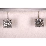 A pair of 18ct white gold diamond stud earrings, 0.80pts total.