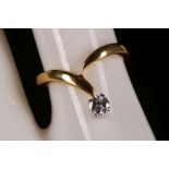 An 18ct gold and diamond solitaire ring (dia. 0.17ct).
