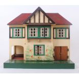 A 1950s Tri-ang model No61, all original dolls house, front opening to reveal two rooms, with