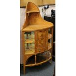 A Sheraton Revival marquetry satinwood bowfronted corner cabinet with cupboard and drawer, flanked