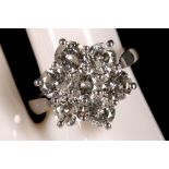 An 18ct white gold and diamond seven stone floral cluster ring, dia 3.65ct.