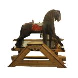 A rare large 1900's Lines Brothers rocking horse, marked underneath J & G L 3,  with rare library