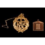 A 9ct gold Rolls Royce novelty pendant, together with Royal Air Force, 9ct gold badge. (2)