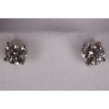 A pair of 14k white gold and diamond studs (dia. 0.84ct).