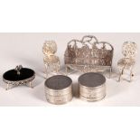 An Edwardian silver dolls furniture garden seat, character and putti decoration with god, English