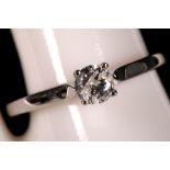 An 18ct white gold and diamond solitaire ring, 0.34ct, including certificate (size N/NO).