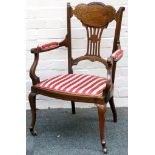 A good 19th Century solid rosewood and brass inlaid open armchair, with shaped and carved splat back