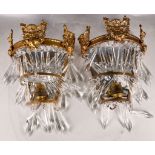 A pair of attractive late 19th Century Continental gilded brass wall lights, embossed with cherubs