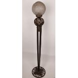 A 1930's Muller Fres floor lamp, moulded frosted glass shade, on wrought iron base, shade signed