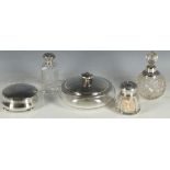 An early 20th Century silver top dressing table items, scent with hobnail and star cut body, cologne