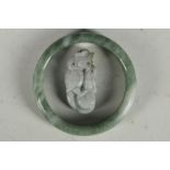 A Chinese jade bracelet and small jade carving of a dragon with ball, 4.7cm W.