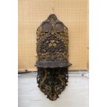 A 19th Century Turkish carved mahogany wall bracket, with floral pierced decoration and gilt