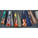 Five various violins; four with bows, all in hard carry cases. (5)