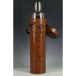 A late Edwardian picnic flask, leather cylindrical case and thermos, 36cm H.