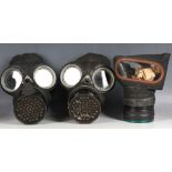 Three British WW2 gas masks / respirators.