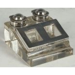An Edwardian silver and glass desk compendium twin silver top ink pots, double stamp holder with pen