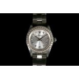 A ladies stainless steel 1996 Rolex Oyster perpetual, with diamond set dial and bezel, boxed with