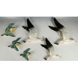 A set of three Beswick pottery flying seagulls, painted in naturalistic colours, pattern No922-2.