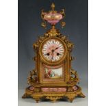 A 19th Century French gilt bronze mantel clock, the well cast body, set with pink ground Sèvres
