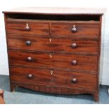 A Victorian mahogany chest of drawers, having a shallow drawer over two short and three long