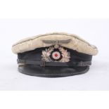 A German assembled 'Kriegsmarine' visor cap, silk, band for August Schellenberg, Heer cockade and