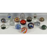 A collection of fifteen glass paperweights, to include Millefiori, swirl, floral, etc. Also