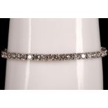 A 14k white gold and diamond line bracelet, 9.25ct total.