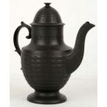 A black basalt coffee pot, probably 18th Century, with engine turned decoration, unmarked, 28cm.