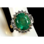 An 18ct yellow gold, emerald and diamond cluster dress ring.