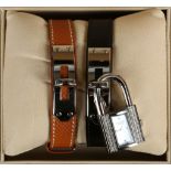 A ladies' Hermès Kelly dress watch, with interchangeable black/brown leather bracelets, and