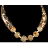 Possibly Sabbadini. A polished agate bead and seed pearl necklace, with gilt metal sections and gold