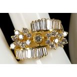 An 18ct gold and diamond set cluster dress ring.