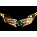 An 18ct gold, emerald and diamond set necklace, the central gem set scroll flanked by flat curb