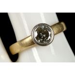 An 18ct gold and diamond solitaire ring.