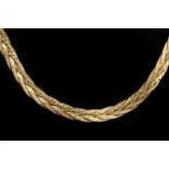 A 14k gold flat weave necklace with slide-clasp and safety.