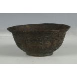 A Chinese bronze bowl of archaic form, studies of dragons, four character marks to base, 9.8cm