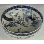 A Chinese bowl, blue glaze, studies of cranes and prunus, double ring foot, 21.2cm diameter.