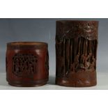 A Chinese bamboo carved brush pot with cartouches of scholars in a garden and phoenixes, together