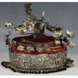 A Chinese mao ethnic minority, tribal headdress, ornately decorated with birds in white metal.