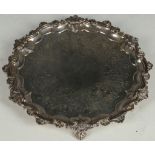 A Georgian hallmarked silver circular tray with cast piecrust edge with cast rococo, scrolls, and