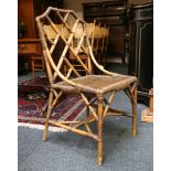 A pair Angraves bamboo and wicker chairs with trellis back splat, sold together with a small