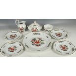 Ginovi, a cake plate, three side plates, a sucrier and cover, jug and tea cup and saucer by