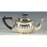 A hallmarked silver teapot of gadrosed melon form.