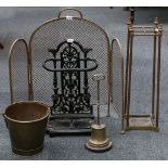 A brass four division stick stand, an antique brass campana door stop, an antique brass pail, a