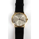 A 1960s Zenith 18 carat gold gent's dress wristwatch with black leather strap.