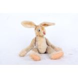 A 1960s Steiff Rabbit with ‘button in ear’, blue and black googlie eyes, fully jointed (tear to