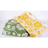 Two long lengths of vintage yellow and white and green and white floral towelling. (2)